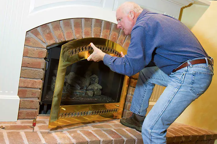 man fixing the chimney