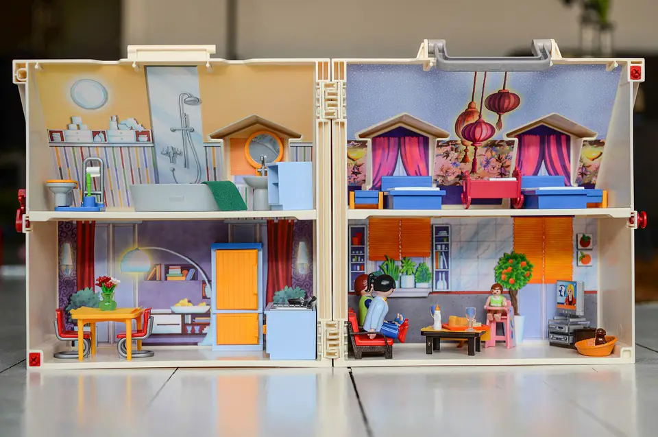 Image of the inside of a dollhouse with sectioned off rooms