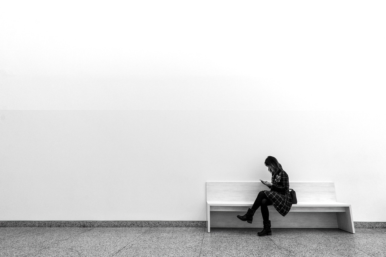 woman sitting on a bench with white backgroun