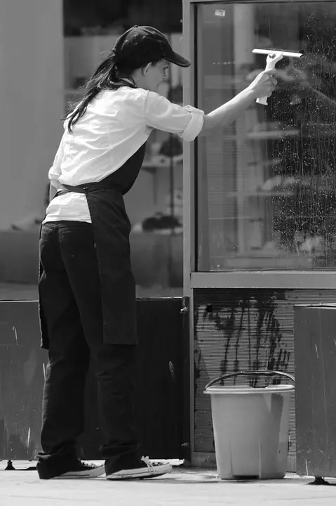 woman cleaning the windows